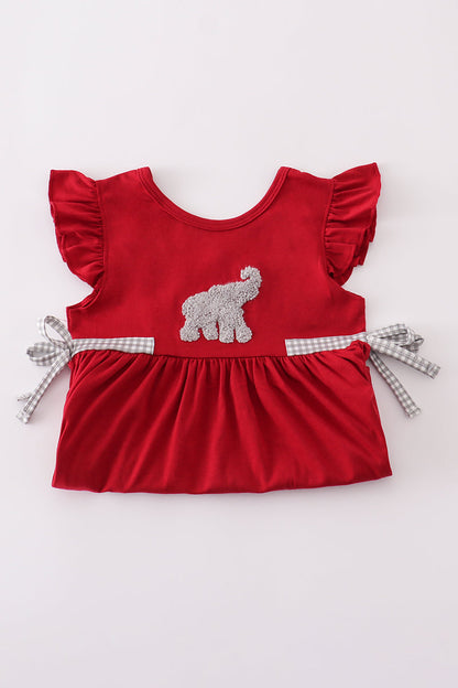 Close-up of a French knot Alabama elephant on a girls' ruffle shorts set.