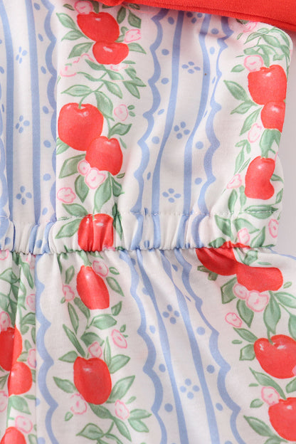 Close-up of red apple print and bow on girls jumpsuit – Cloudling Kids Clothing