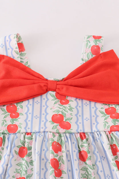 Adorable girls' dress featuring a sweet apple print and decorative bow.