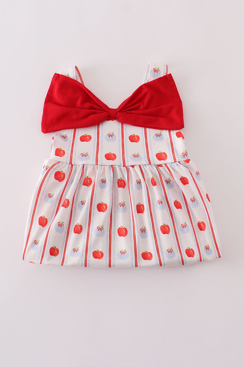 Adorable girls' red dress featuring a sweet apple print and decorative bow.