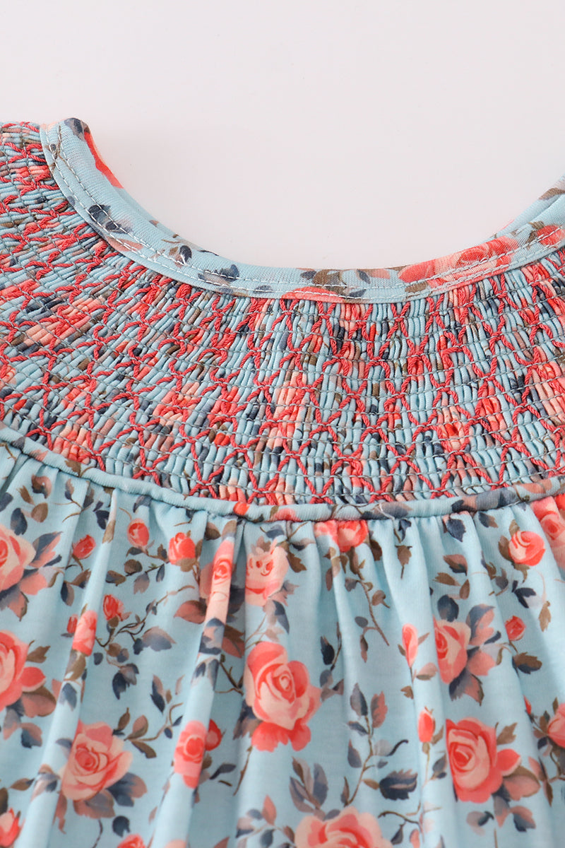 Close-up of smocking and blue floral fabric on baby bloomer set – Cloudling Kids Clothing