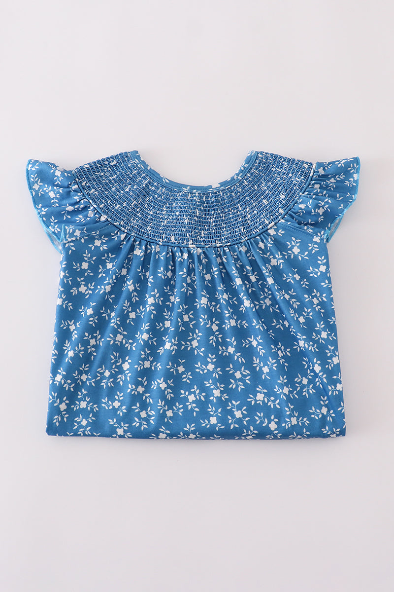 Toddler girl's comfortable blue floral pattern smocked dress.