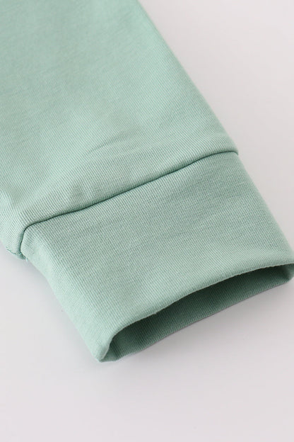 Sage pumpkin french knot ruffle top