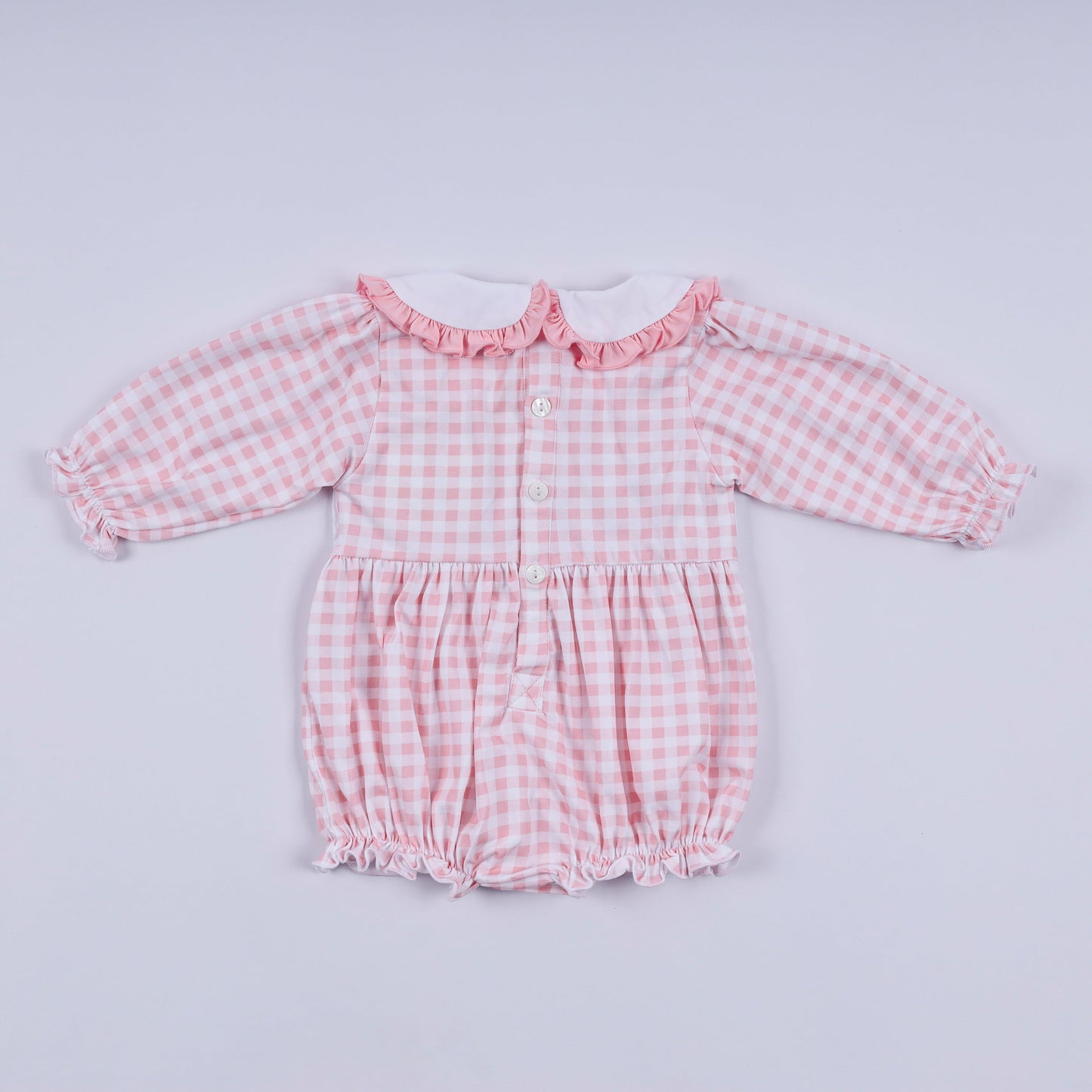 Pink gingerbread hand smocked gingham ruffle bubble