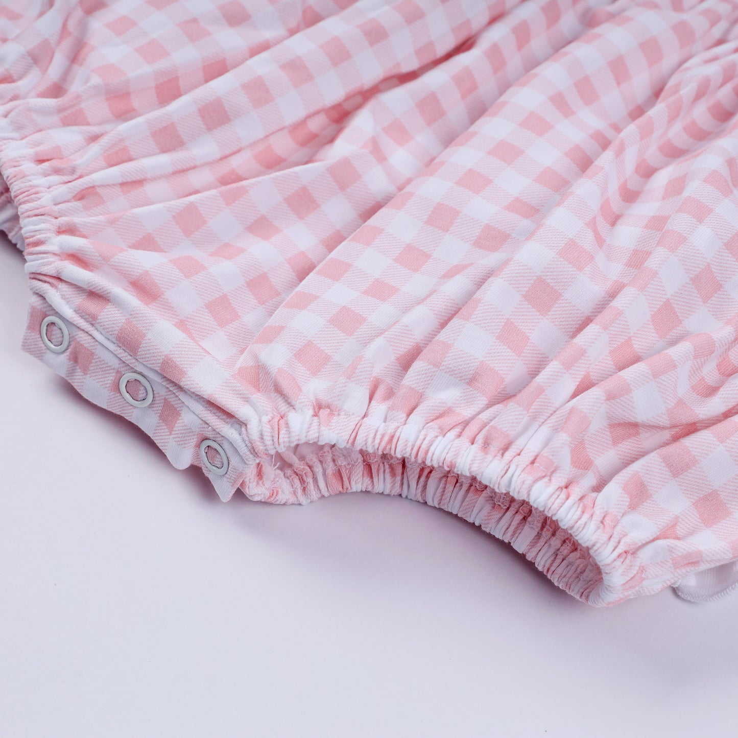 Pink character hand smocked gingham ruffle bubble