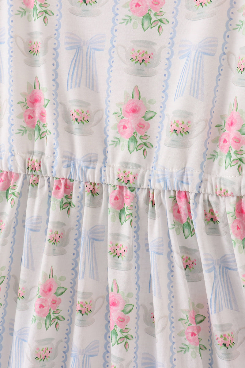 Elegant women's floral midi dress with a bow and ruffles, perfect for spring/summer.