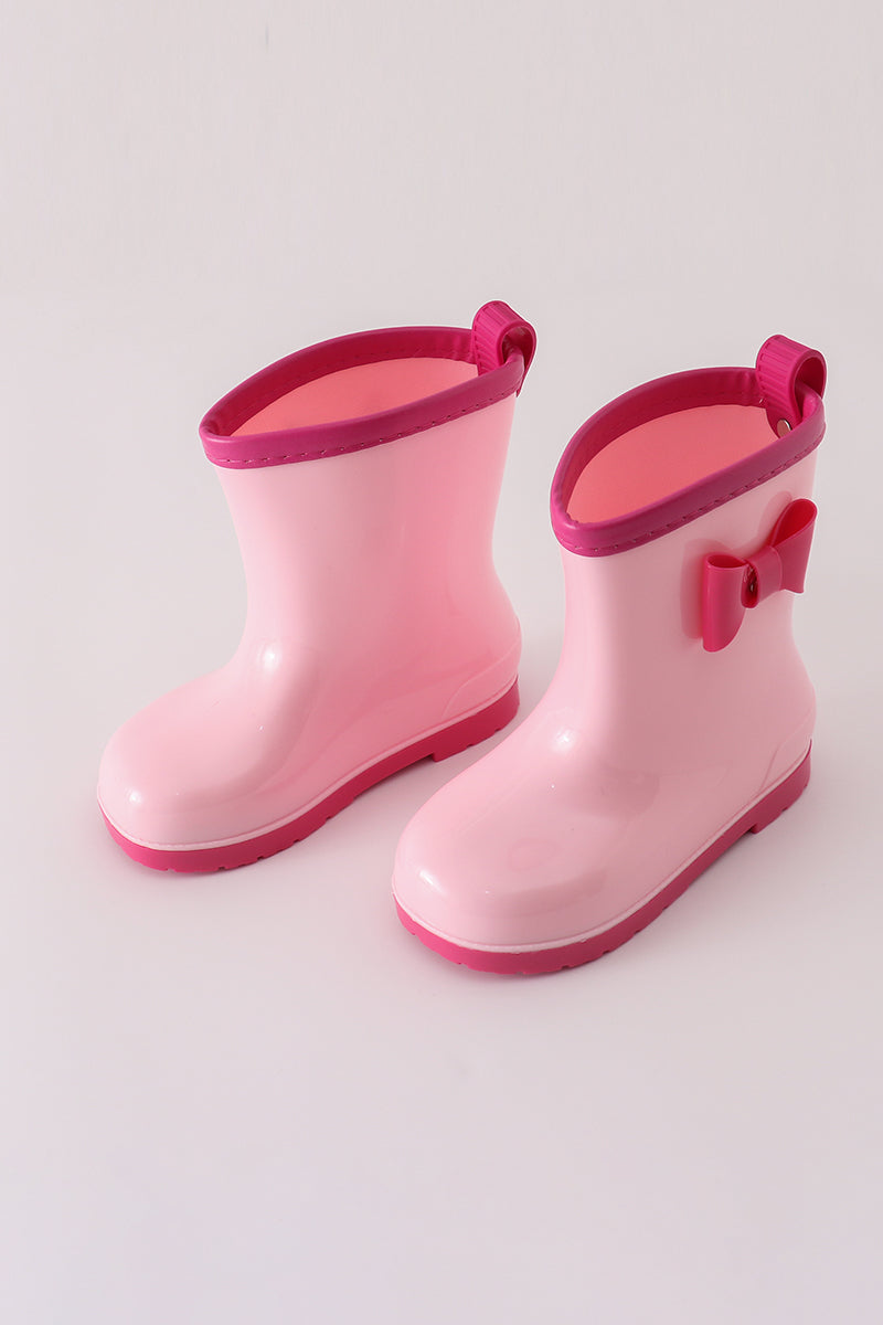Girls' pink rain boots with bow detail by Cloudling Kids Clothing